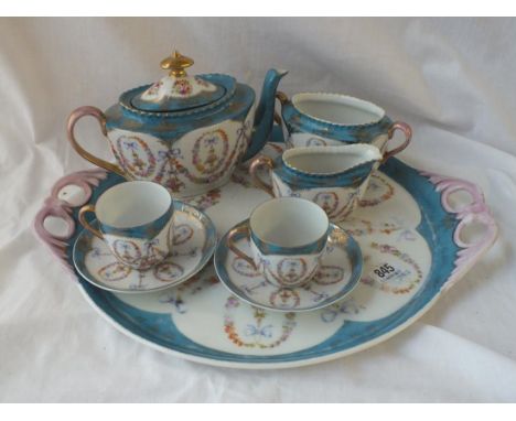 A decorative cabaret set with 2 handle tray, teapot, sugar and cream jugs + 2 cups a saucers.