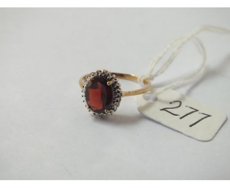 A garnet &amp; diamond cluster ring in 9ct - size N - 1.9gms