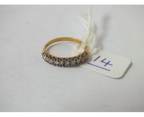 A diamond half hoop ring set in 18ct gold - size L - 2.1gms