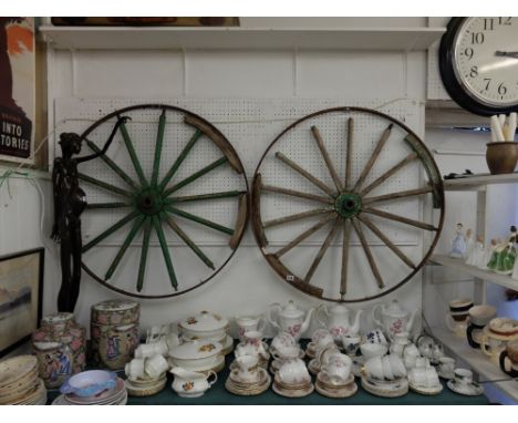 Two Victorian wheels and a old ladder 