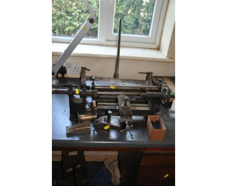 A SMALL SHEET METAL BENDER, 39cm wide, a small sheet metal roller 35cm wide, a small lathe 55cm total width