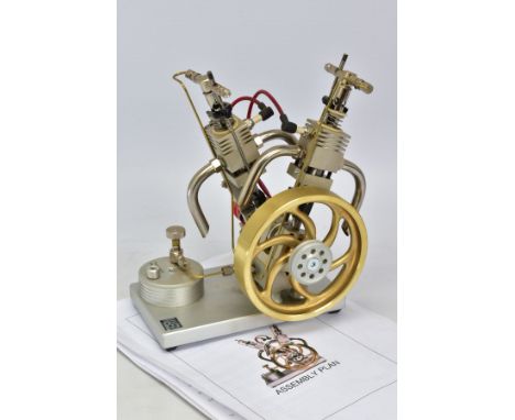A MAIER MECHANIC V2 GAS ENGINE, not tested, diameter of flywheel approximately 12.5cm, mounted on a aluminium base with fuel 
