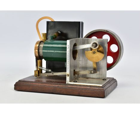 A STIRLING SINGLE CYLINDER ENGINE, not tested, looks to be scratch or kit built, diameter of flywheel approximately 8.5cm, mo