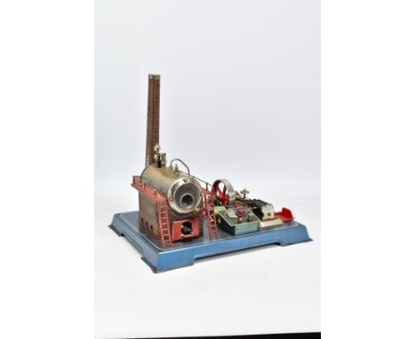 AN UNBOXED WILESCO D24el LIVE STEAM ENGINE, not tested, horizontal boiler mounted on tinplate brick pattern plinth with chimn