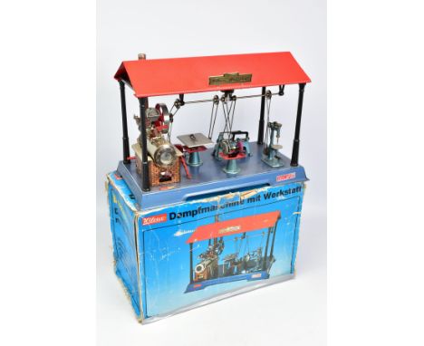 A BOXED WILESCO D141/66 LIVE STEAM WORKSHOP WITH DYNAMO, not tested, horizontal boiler on tinplate brick pattern plinth with 