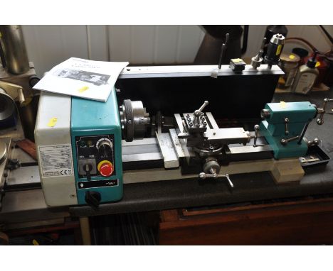 AN AXMINSTER MODEL ENGINEERS SERIES C1 MICROLATHE, Mk2 and two drawers full of cutting and adjustment tools and a quantity of