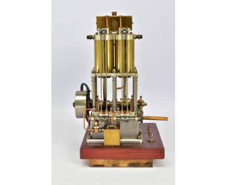 A HANDBUILT MODEL VERTICAL TWIN CYLINDER MARINE ENGINE, not tested, spirit or gas fired, fitted spark plug (missing) of brass