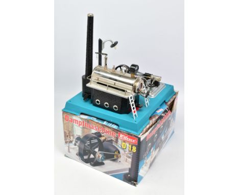 A BOXED WILESCO D18 LIVE STEAM ENGINE, not tested, horizontal boiler on tinplate brick pattern plinth with chimney, powering 
