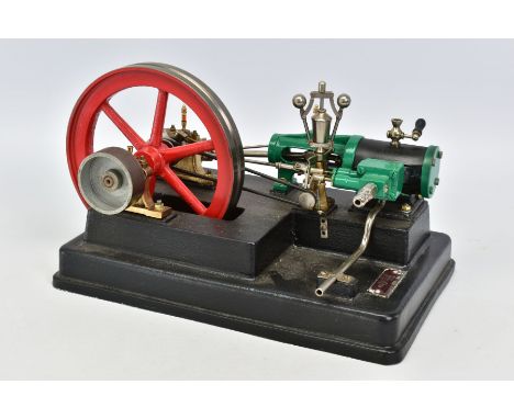 A BIOFIX HORIZONTAL SINGLE CYLINDER LIVE STEAM ENGINE, not tested, diameter of flywheel approximately 16cm, govenor  on a cas
