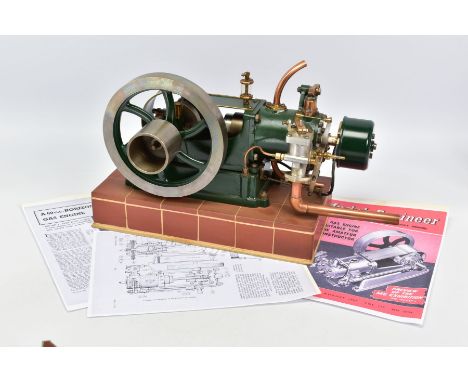 A CENTAUR GAS MODEL HORIZONTAL STATIONARY ENGINE, not tested,  fitted with ignition coil and carburetor, mounted on a tiled m