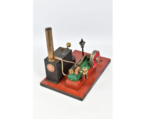 A STUART TURNER S50 LIVE STEAM ENGINE, not tested, horizontal copper boiler powering a single cylinder engine and flywheel (d