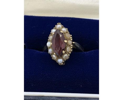 A 9ct gold ring with ruby and seed pearls