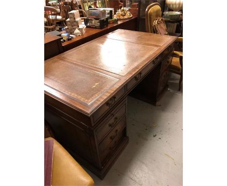 A Partners pedestal desk with three drawers over three on each pedestal