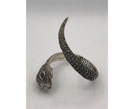 A Very unusual silver and Marcasite snake bangle set with watch to the head and ruby eyes