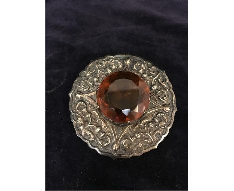 A Scottish sash brooch with a central set cairngorm