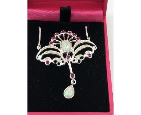 A Silver Art Nouveau style ruby and opal pendant necklace