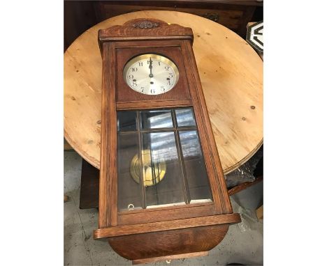 An oak wall clock
