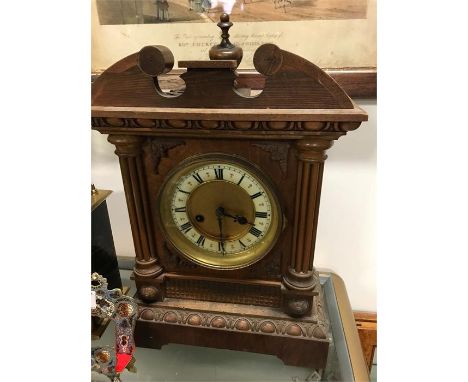 A mantle clock in wood