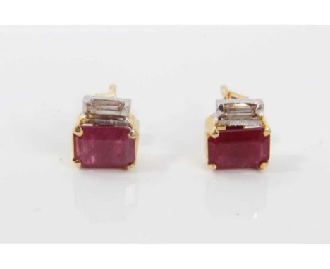 Pair of ruby and diamond earrings, each with a rectangular step cut ruby measuring approximately 7mm x 4.85mm with a baguette