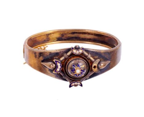 Victorian Etruscan revival hinged bangle with seed pearl and blue enamel star and crescent moon motifsCondition report: One o