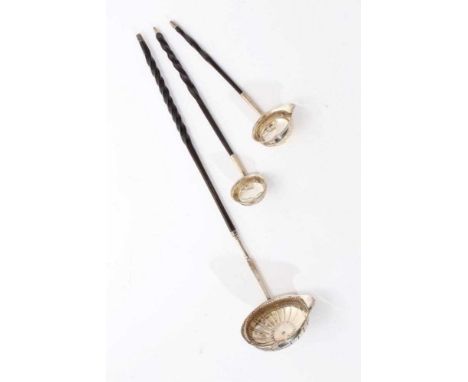 Early 19th century silver toddy ladle of oval form, with flared rim and chased decoration, engraved initials and twisted whal