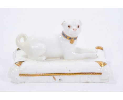 Minton model of a pug, circa 1831-40, modelled on a cushion base and sparsely decorated, 10.5cm wide x 6cm highProvenance: De
