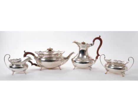 1920s four piece silver teaset comprising, teapot of compressed baluster form with pierced flared border, scroll handle and h