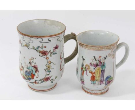 Two Chinese 18th/19th century famille rose porcelain tankards, painted in the Mandarin style with figural scenes, the largest