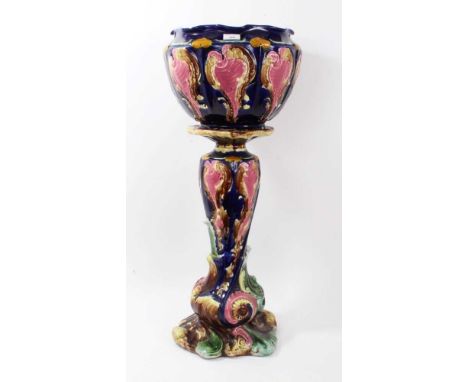 Victorian majolica relief moulded jardinière and stand, depicting cartouches and foliate scrolls, total height 85cmCondition 