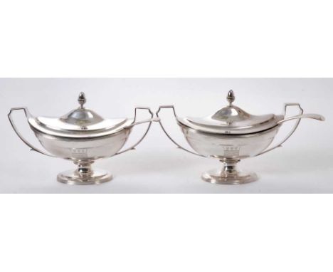 Fine quality pair of George III silver sauce tureens of navette form, with engraved armorial crests and shields, twin handles