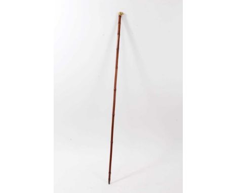 19th century sword stick, carved ivory dogs head knop with glass eyes, on bamboo cane, 90cm