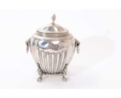 Victorian silver tea caddy with half fluted decoration and engraved presentation inscription, twin lion mask ring handles, an