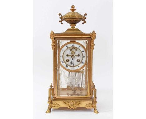 Early 20th century four glass mantel clock retailed by Maple &amp; Co. Paris, with French movement with visible escapement an