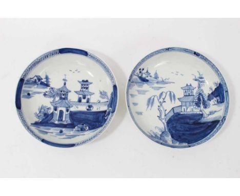 Two similar Lowestoft blue and white saucers, c.1790, painted with Oriental pagoda patterns, ex. Kitty Brumpton collectionCon