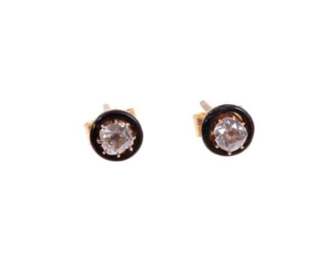 Pair of diamond and black enamel earrings, each with an old cut diamond in claw setting within a circular black enamel border