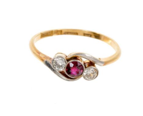 Edwardian ruby and diamond three stone ring with a central round mixed cut ruby flanked by two old cut diamonds, all in plati