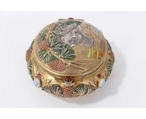 Fine quality French Art Nouveau silver gilt and gem-set box of circular form, the hinged lid decorated in relief depicting a 