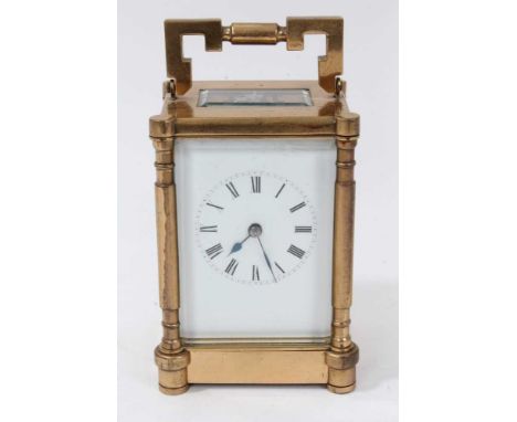Late Victorian striking carriage clock with enamel dial in brass case, striking on gong. 17cm, key present.