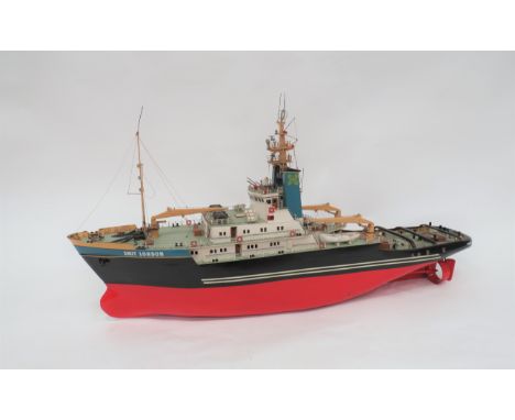 Well Made Model Of "Smit. London" Tug Boat37 inch, painted wooden hull.  Top deck lifts off to fit an engine.  Some plastic p