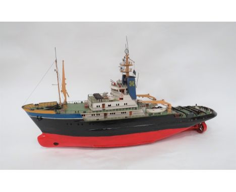 Well Made Model Of A London Tug Boat38 inch, painted wooden hull.  Top deck lifts off to fit an engine.  Some plastic parts f