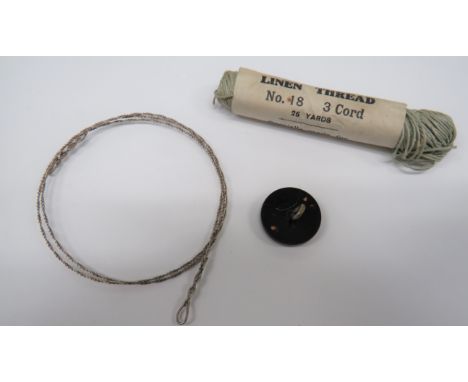 RAF Escape and Evasion Itemsconsisting twisted wire snare ... RAF battledress, black composite, button compass.  The rear wit