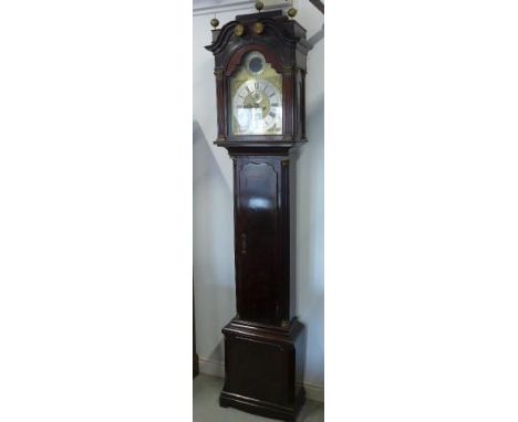 A mahogany 8 day striking longcase clock with an arched brass 12 inch moon roller dial, secondary dial and calendar and silve