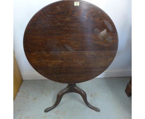 A Georgian tilt top side table with an oak tripod base 