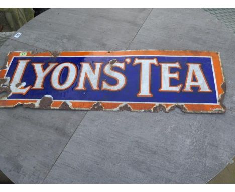 A Lyons Tea enamel sign - 30cm x 90cm - worn condition 