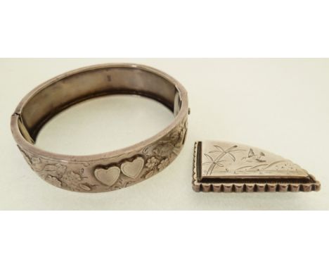 VICTORIAN SILVER HINGE OPENING BANGLE, embossed with birds, flowers and two applied hearts, 1892, AND A SMALL VICTORIAN SILVE