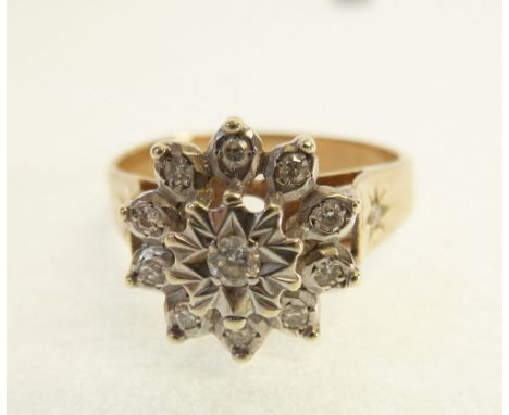 9CT GOLD DIAMOND CLUSTER RING, illusion set with a central round brilliant cut diamond, 0.05ct approx., with a ten diamond cl