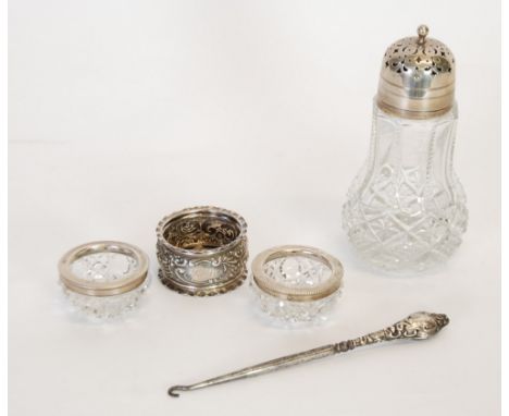 SILVER FOLIATE EMBOSSED NAPKIN RING, Birmingham 1900, A MOULDED GLASS SUGAR CASTOR, WITH TWIST OFF PIERCED SILVER LID, Birmin