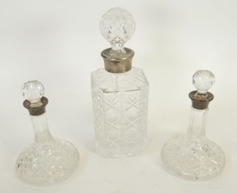 PAIR OF MOULDED GLASS MINIATURE SHIP DECANTERS, WITH SILVER COLLARS, 6 ½" (16.5cm) high, Birmingham 1983, AND A MOULDED GLASS