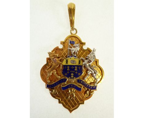 9CT GOLD AND ENAMEL SALFORD EX-MAYOR BADGE, shield form with applied enamelled coat of arms, 2 1/8" (5.3cm) long, Birmingham 