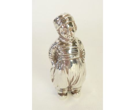 SILVER PEPPERETTE, by BERTHOLD HERMANN MULLER, IN THE FORM OF A DUTCH BOY, 3 ½" (8.9cm) high, London 1915, 2.89oz